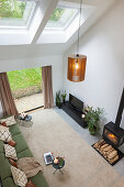 Modern, double-height living room with skylights