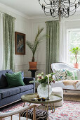 Classic, elegant living room with panelled walls in period building