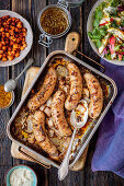 Baked white sausage with mustard marinade