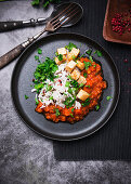 Vegan lentil and carrot bolognese with fried tofu and wild rice and basmati mixture