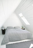 Rustic bedroom under wood-clad gable roof