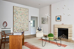 Desk and open fireplace in classic living room