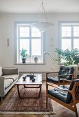 Retro furniture in classic living room with period windows