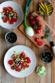 Cherry tomato salad with spring onions, chillis and capers