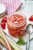 A jar of rhubarb and strawberry compote