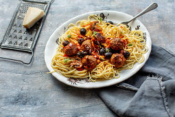 Spaghetti with Italian meatballs in olive tomato sauce
