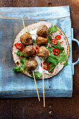 Flatbread with meatball skewers