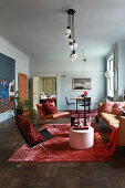 Glamorous living room with pale blue walls and furnishings in various shades of red