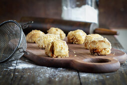 Little balls of sugar coated Carrot Cake Monkey Bread dough being prepped for baking