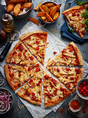 Pizza with chicken breast and red onions