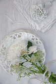 White bouquet of chrysanthemums, carnations, astrantia and cow parsley