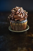 A cupcake with chocolate cream for Valentines day
