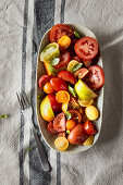 A colourful tomato salad with fresh basil