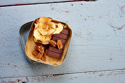 Pecan nuts, chocolate and dried apple slices