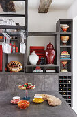 View past kitchen counter to shelves beyond