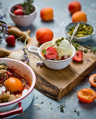 Apricot and strawberries crumble with vanilla ice cream