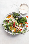 Lime chicken salad with broccolini and charred pumpkin