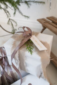 Wrapped gift with torn material used as ribbon