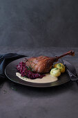 Goose leg with porcini sauce and red cabbage