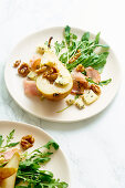 Pear salad with walnuts, prosciutto, arugula and blue cheese