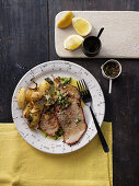 Unbreaded veal escalope with sage and roast potatoes