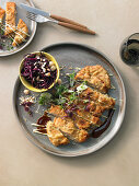 Veal escalope with red cabbage and macadamia nut coleslaw