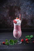 Vegan strawberry ice cream shake with soy cream and fresh berries