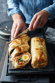 Tuna strudel with harissa, green beans and egg