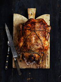 A duck with apple and plum stuffing for Christmas dinner