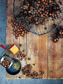 Still life with hazelnuts in a wire basket and nut mill