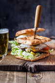 A focaccia burger with beer