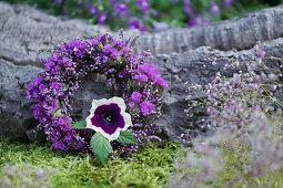 Wreath of broom heather and sea lavender, petunia blossom as eye-catcher