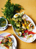 Vegetable and egg platter with herb sauce