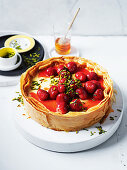 Cheese cake with filo pastry, strawberries and pistachios