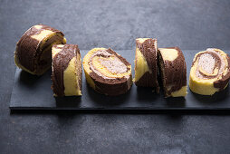 Vegan vanilla-chocolate-Swiss roll with nougat-cream filling