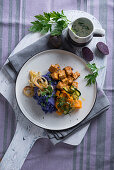 Vegan purple mashed potatoes with zucchini-carrot-vegetables and tofu