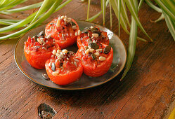 Roasted tomatoes with bacon and dried fruits prepare