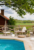 Rattan furniture on side of pool