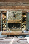 Hunting trophy on stone chimney breast in rustic living room