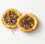 Mini pizza with anchovies and onions