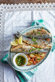 Roast sea bass with caper and rosemary spiked new potatoes