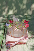 Sweet pea flowers in bowl