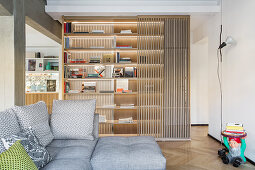 Grey sofa set in front of oak bookcase