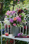 Fragrant late summer bouquet with phlox, hydrangeas, roses, bluebells, amaranth and annual fleabane