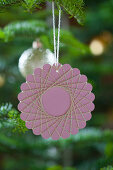 Christmas-tree decoration handmade from paper and yarn