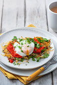 Potato rosti with chorizo, coriander, red pepper dip and poached egg