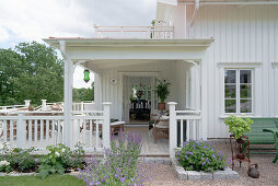 A view of a covered wooden porch