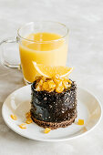 Chocolate cake with orange candied fruit and juice