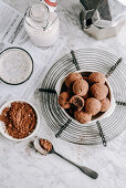 Vegan date and nut truffles dipped in cocoa