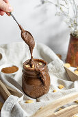 Drip of Homemade Vegan Gluten free Chocolate Hazelnut Spread with Cookies